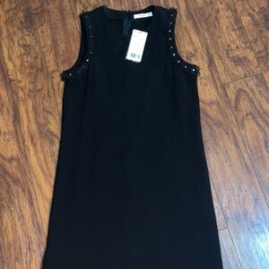 Black sleeveless dress ruffle studs